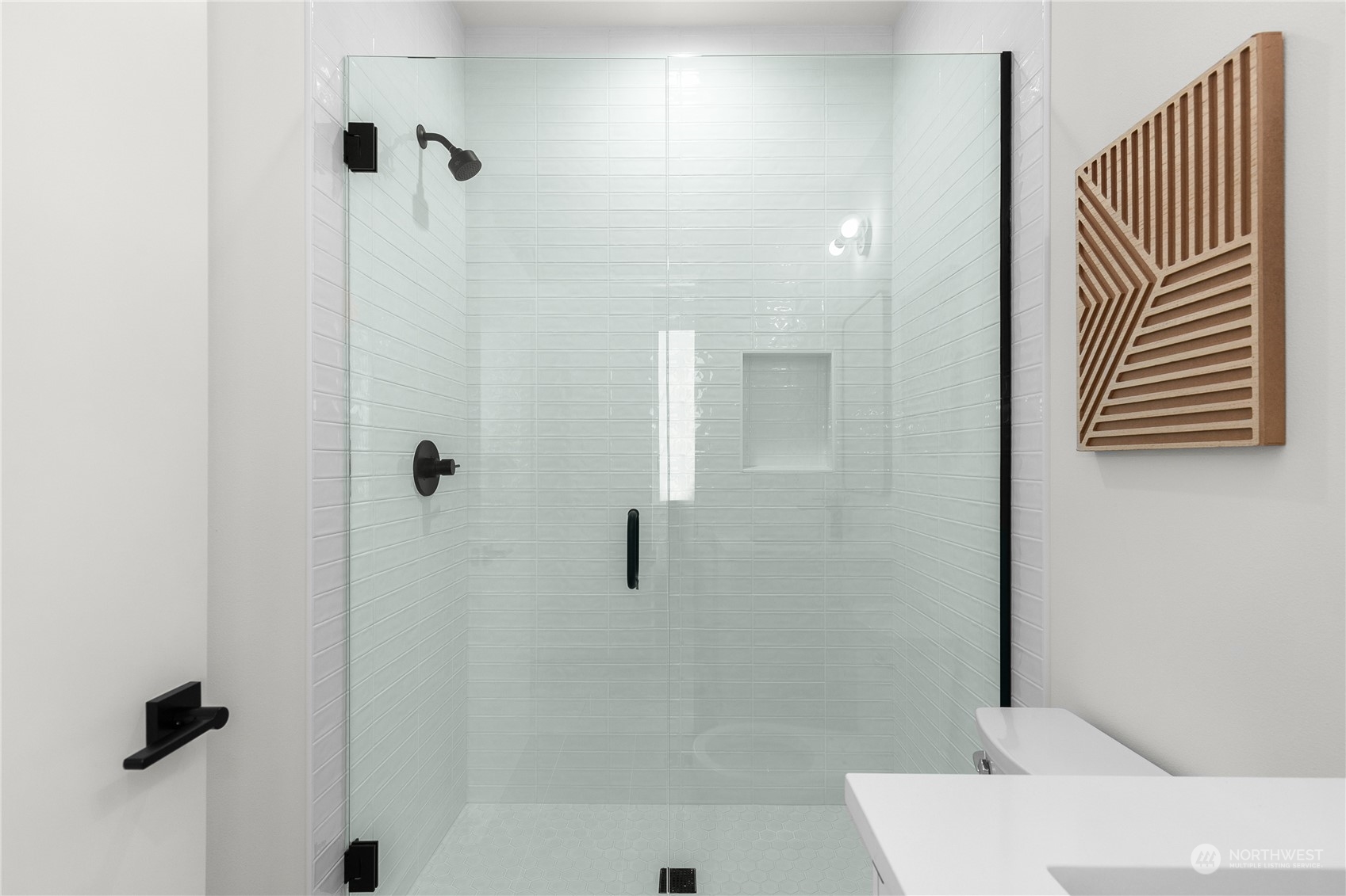 9429 18th Avenue Southwest, Unit B Seattle, WA 98106 - Photo 15 of 28 a bathroom with a sink and a shower