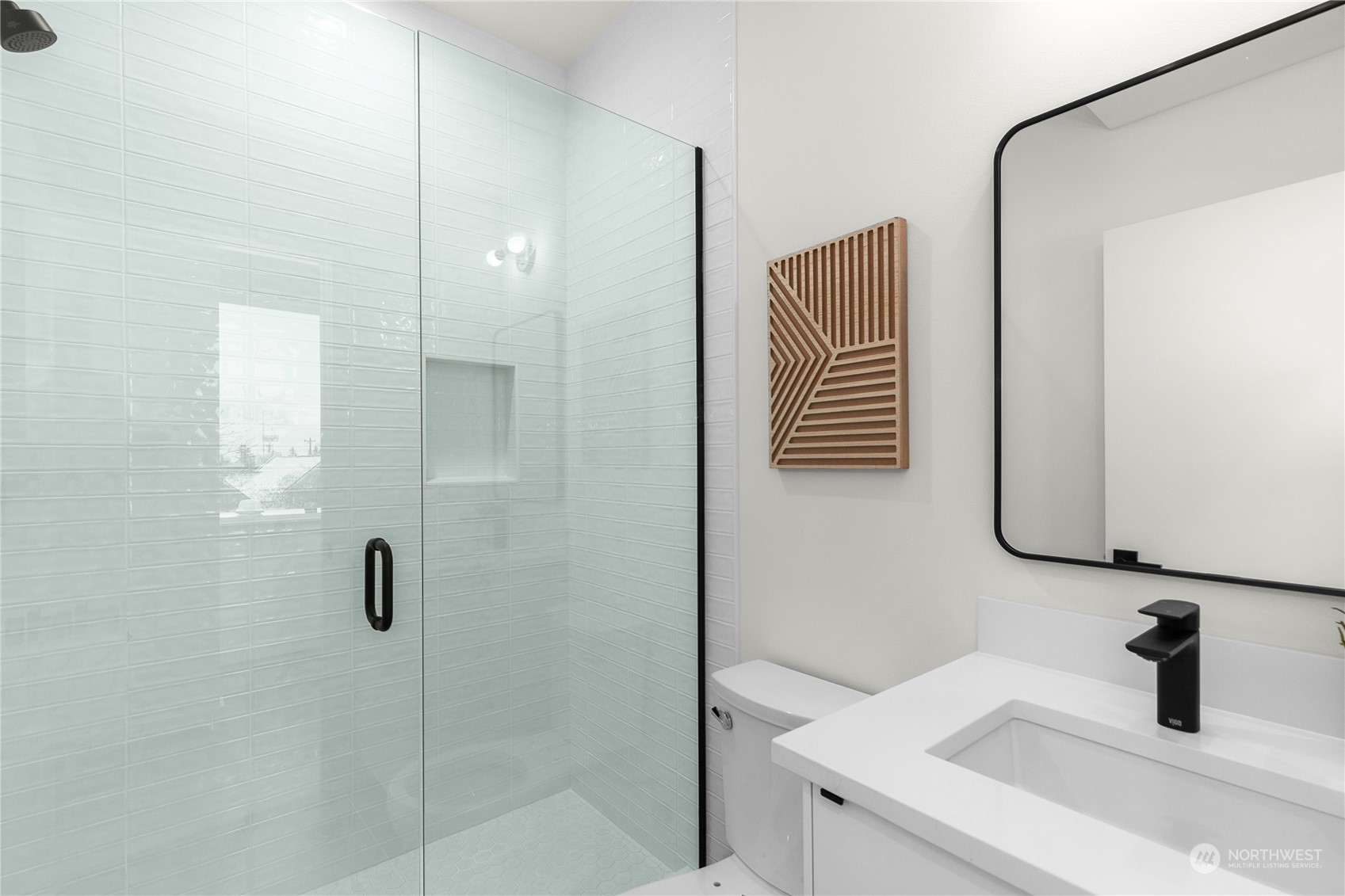 9429 18th Avenue Southwest, Unit B Seattle, WA 98106 - Photo 16 of 28 a bathroom with a sink and mirror