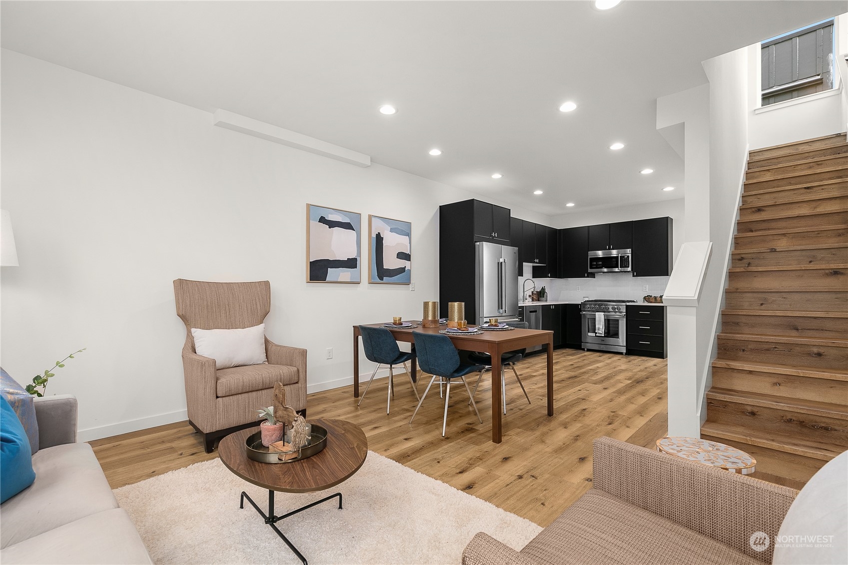 9429 18th Avenue Southwest, Unit B Seattle, WA 98106 - Photo 8 of 28 a living room with furniture kitchen view and a wooden floor