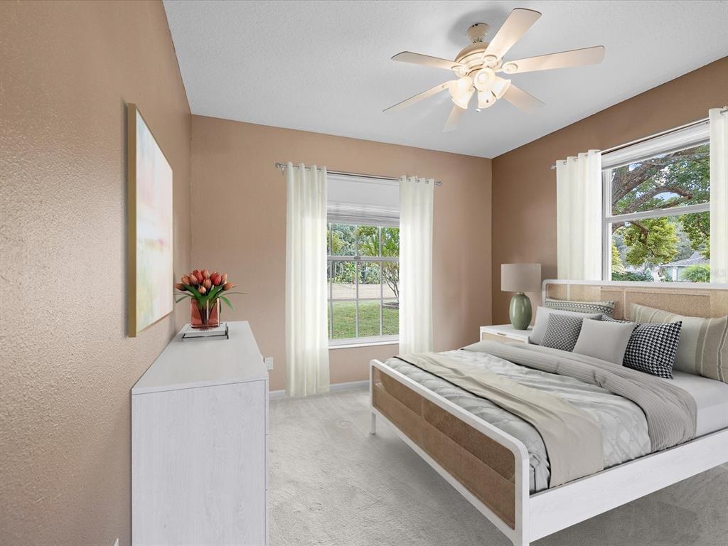 8551 Pratt Drive New Port Richey, FL 34654 - Photo 11 of 100 a bedroom with a bed and a window