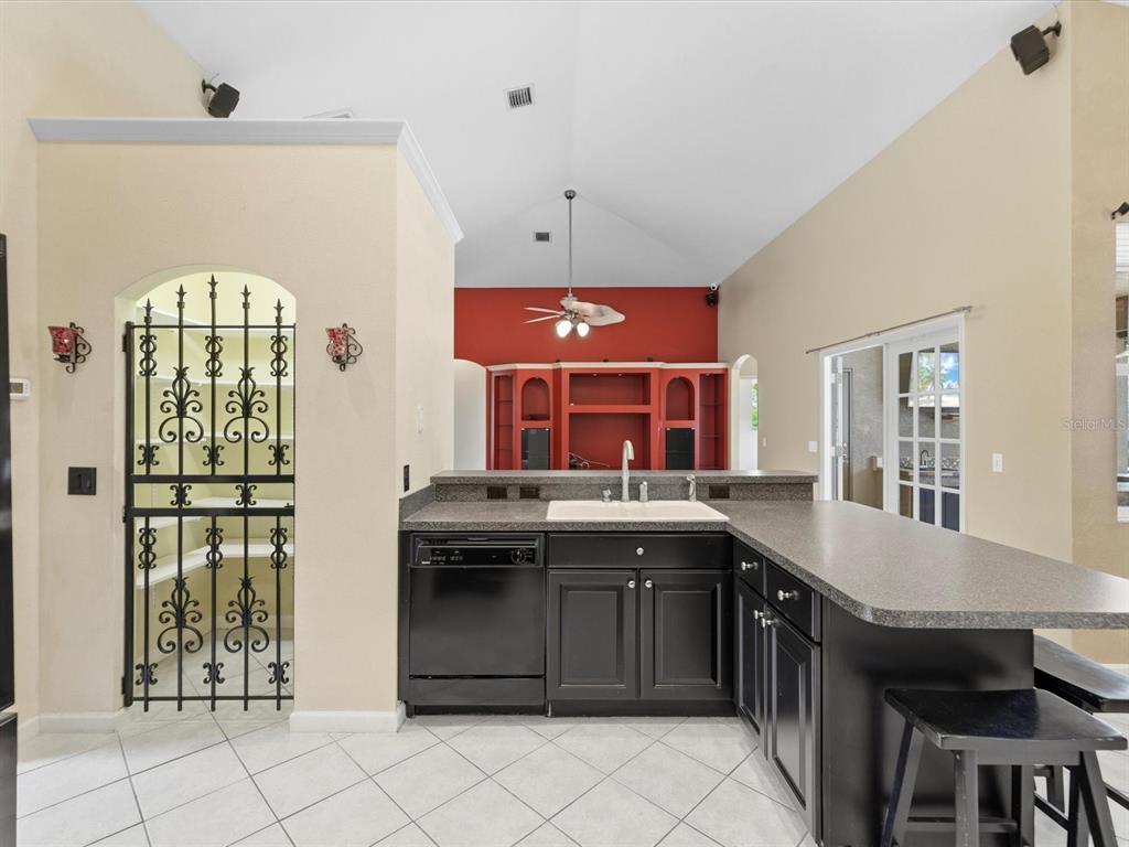 8551 Pratt Drive New Port Richey, FL 34654 - Photo 18 of 100 a kitchen with stainless steel appliances granite countertop a stove and a refrigerator