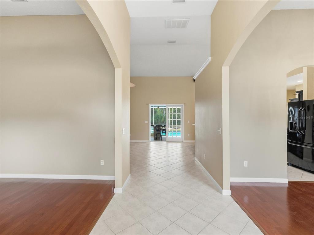 8551 Pratt Drive New Port Richey, FL 34654 - Photo 30 of 100 wooden floor in an empty room with a window