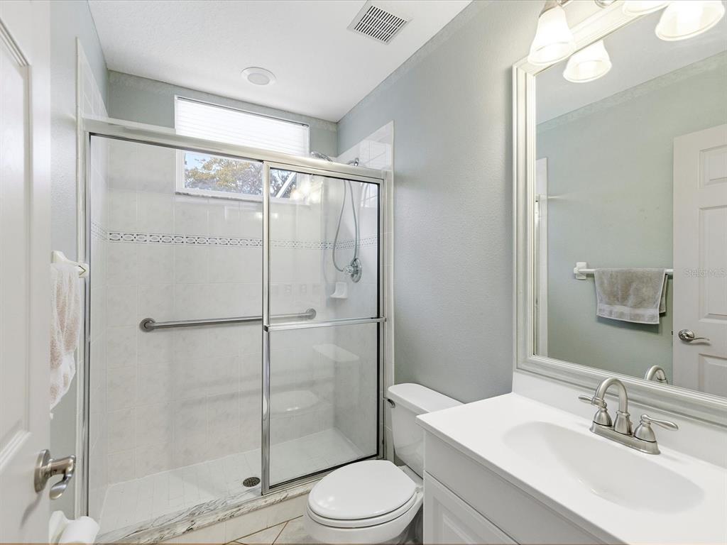 8551 Pratt Drive New Port Richey, FL 34654 - Photo 42 of 100 a bathroom with a sink toilet and shower