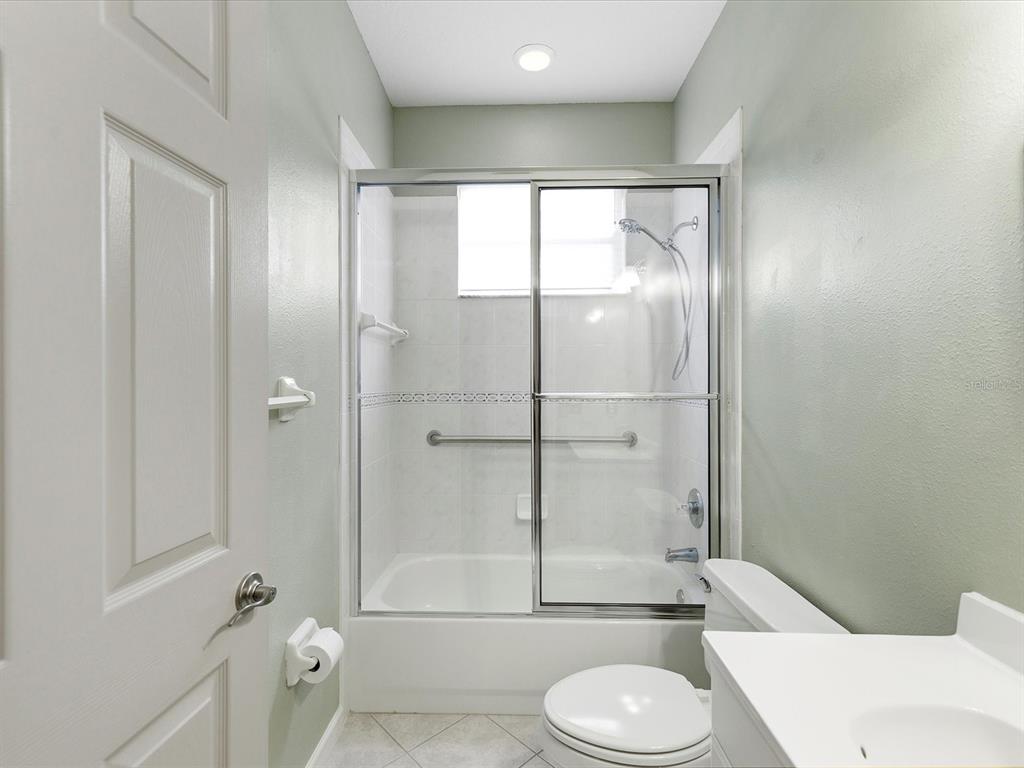 8551 Pratt Drive New Port Richey, FL 34654 - Photo 44 of 100 a bathroom with a toilet a sink and shower