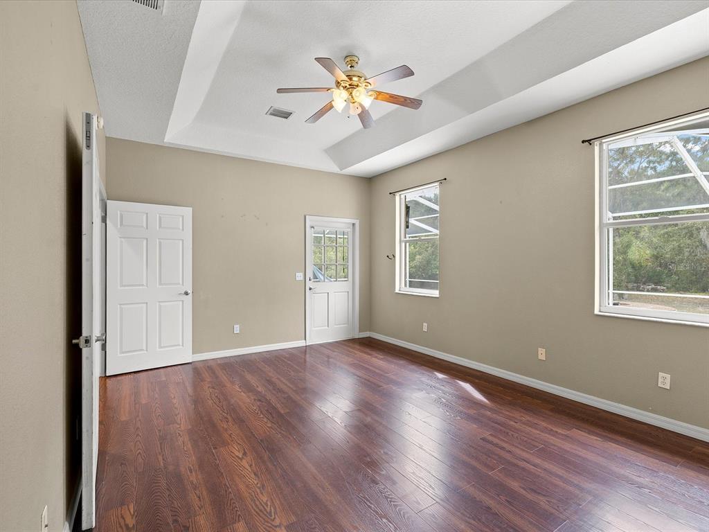 8551 Pratt Drive New Port Richey, FL 34654 - Photo 58 of 100 wooden floor in an empty room with a window