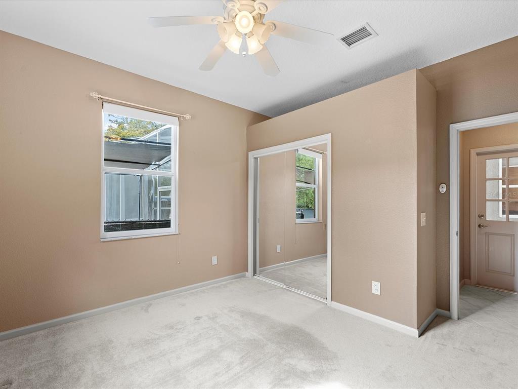 8551 Pratt Drive New Port Richey, FL 34654 - Photo 59 of 100 an empty room with windows and closet