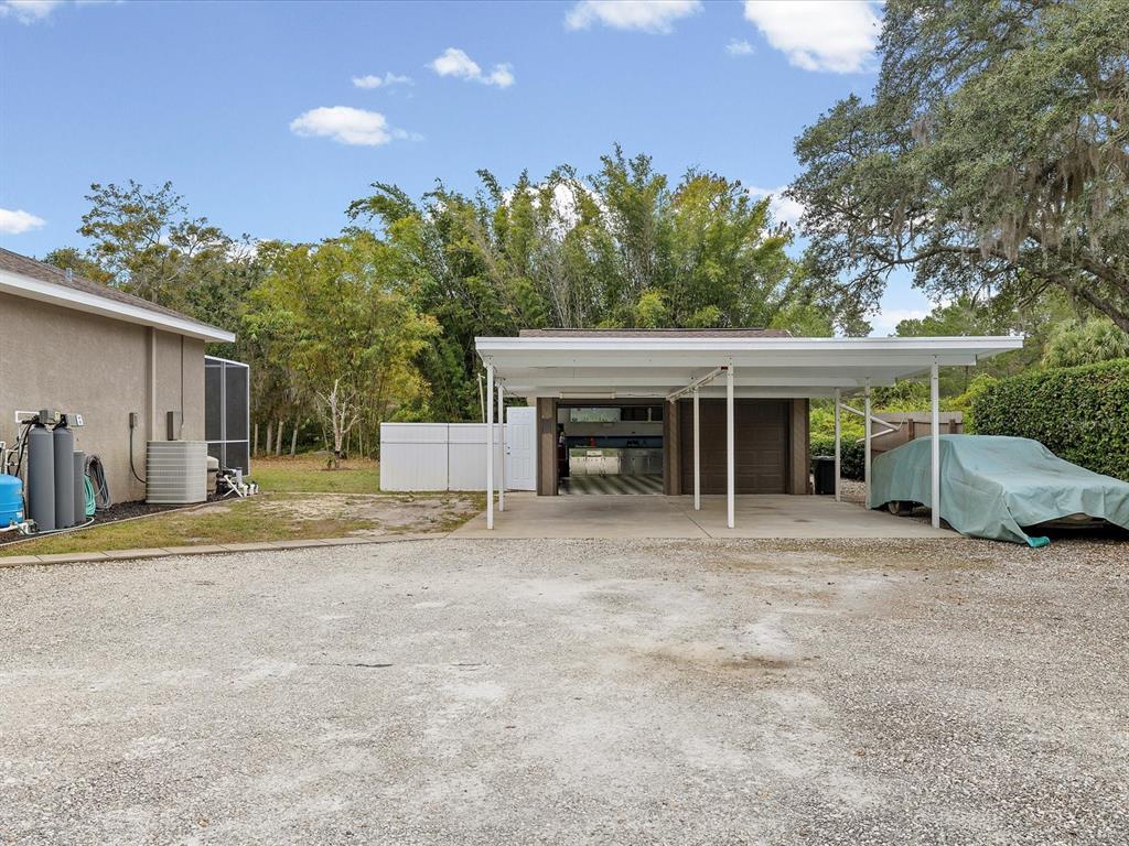 8551 Pratt Drive New Port Richey, FL 34654 - Photo 69 of 100 a view of a house with a outdoor space and porch