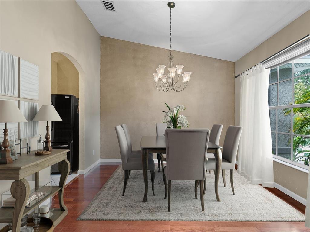 8551 Pratt Drive New Port Richey, FL 34654 - Photo 7 of 100 a view of a dining room with furniture window and wooden floor