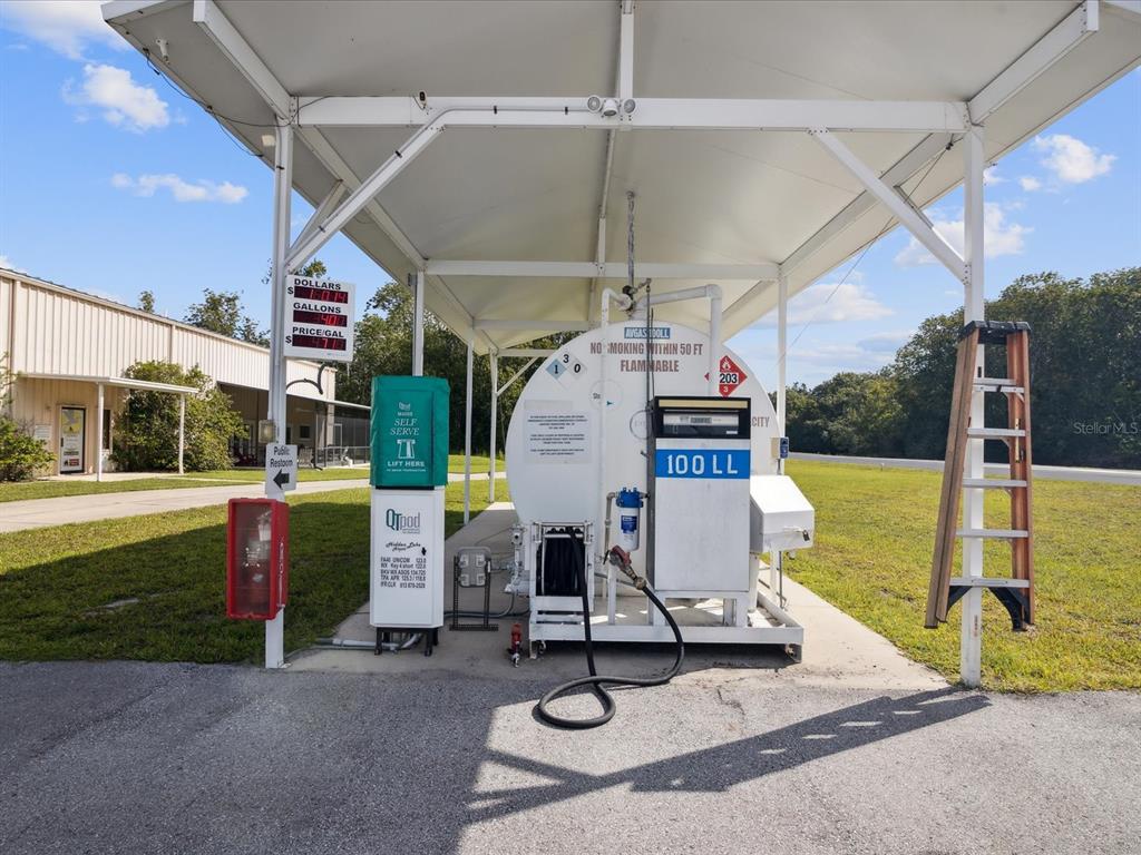 8551 Pratt Drive New Port Richey, FL 34654 - Photo 94 of 100 a view of a patio with a table and chairs under an umbrella