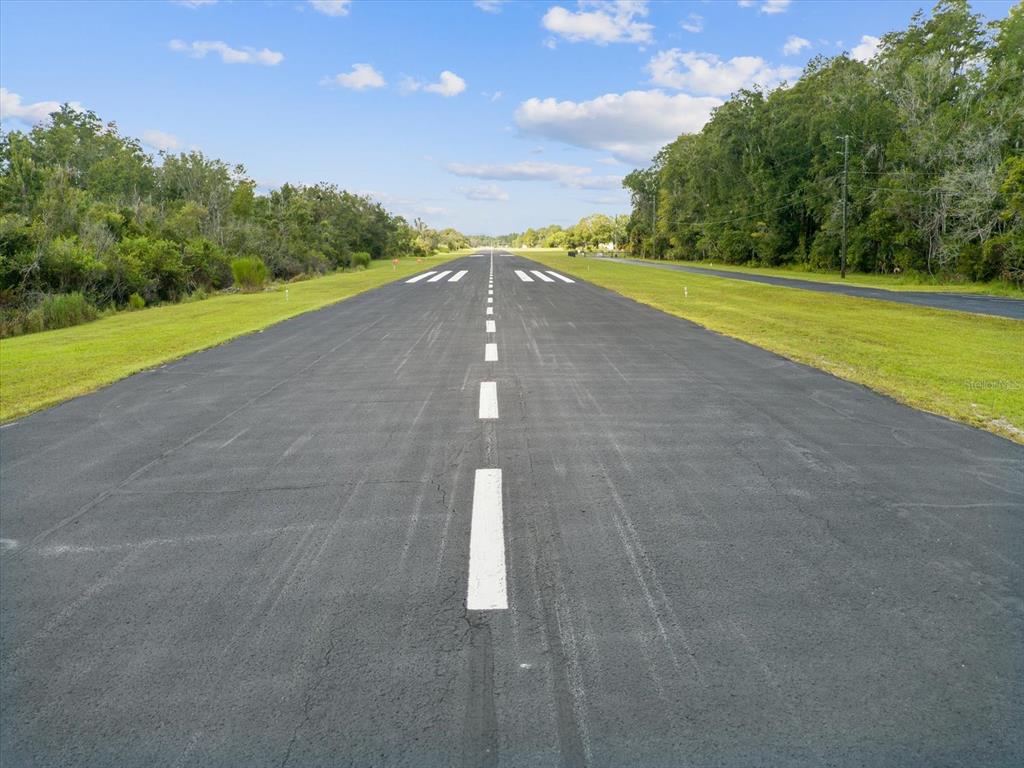 8551 Pratt Drive New Port Richey, FL 34654 - Photo 98 of 100 a view of a big yard with an outdoor space