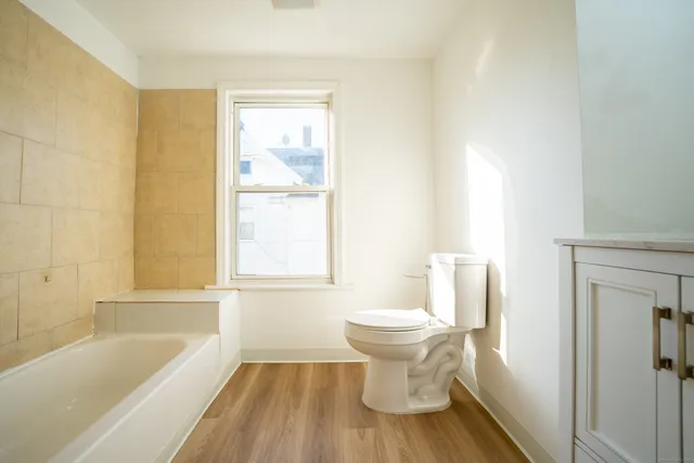 a bathroom with a sink toilet and bathtub
