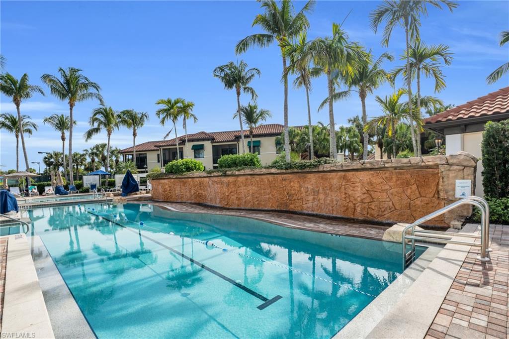 985 Sandpiper Street, Unit I103 Naples, FL 34102 - Photo 27 of 32 a view of a backyard with a patio