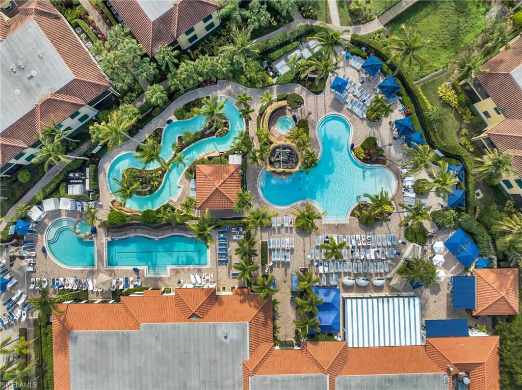 985 Sandpiper Street, Unit I103 Naples, FL 34102 - Photo 31 of 32 an aerial view of a house a yard and outdoor seating