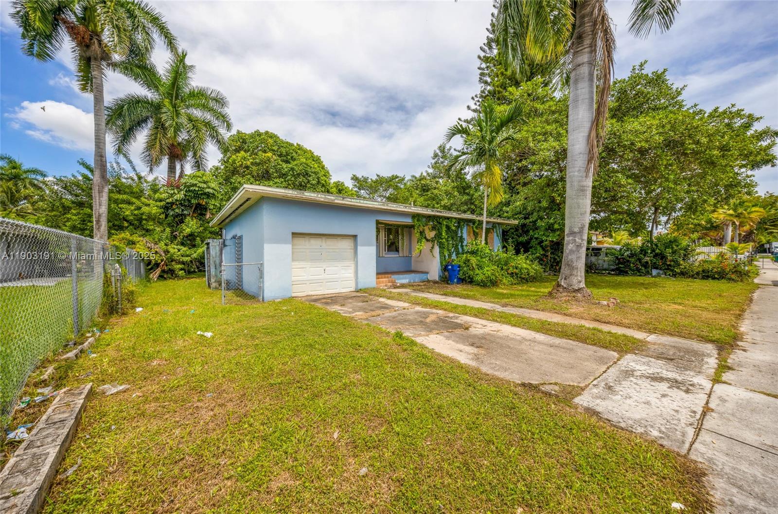 75 Northwest 83rd Street Miami, FL 33150 - Photo 1 of 47 a view of a house with a yard