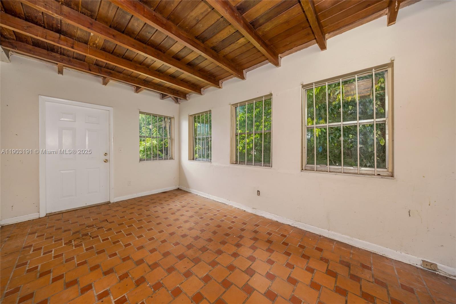 75 Northwest 83rd Street Miami, FL 33150 - Photo 14 of 47 a view of an empty room with a window