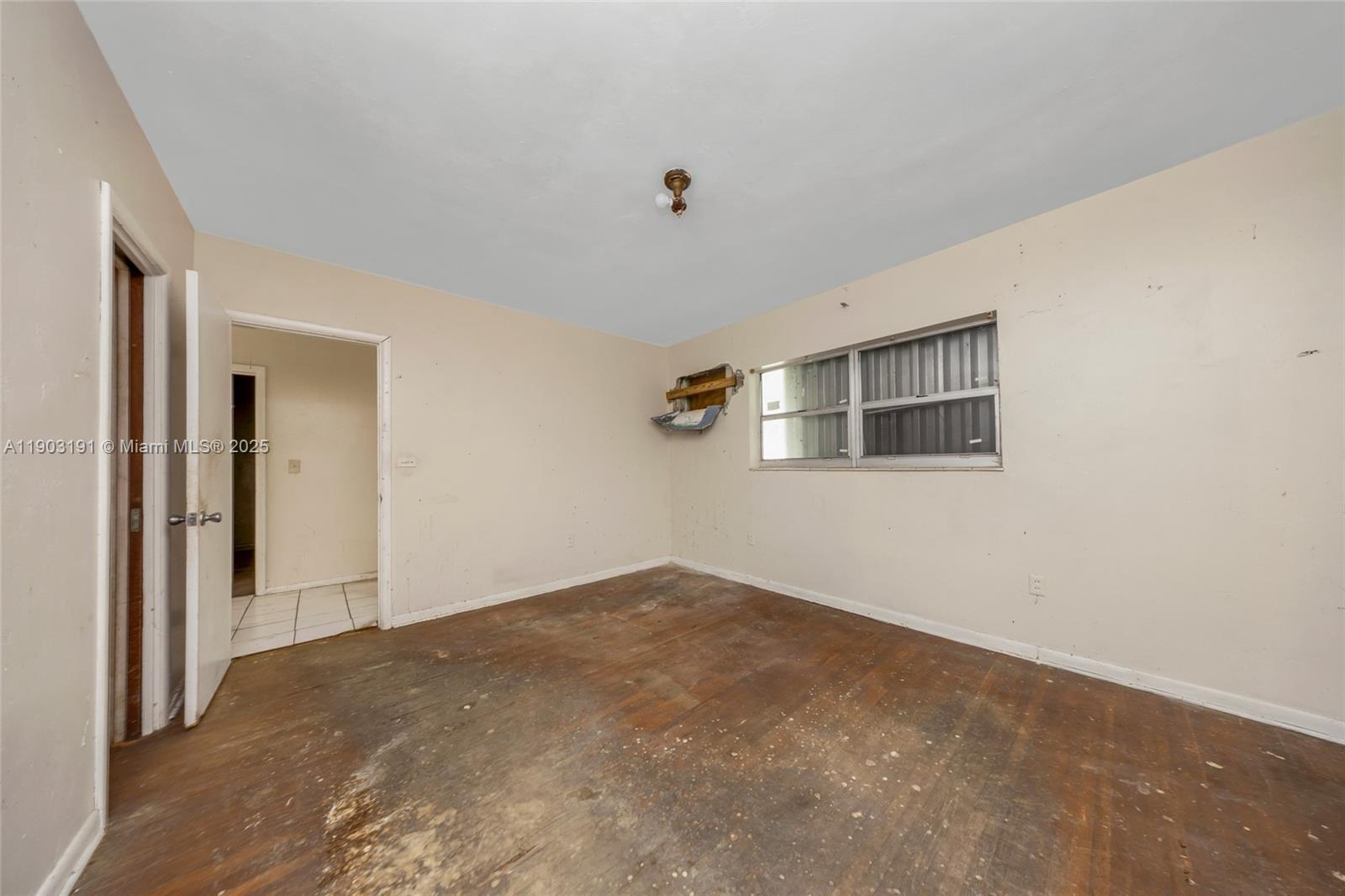 75 Northwest 83rd Street Miami, FL 33150 - Photo 19 of 47 a view of a big room with closet and windows