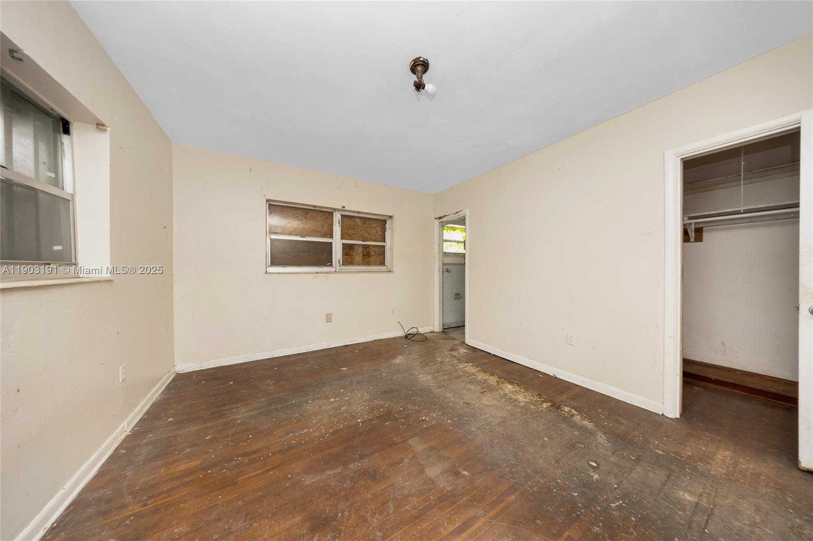 75 Northwest 83rd Street Miami, FL 33150 - Photo 21 of 47 a view of an empty room with a window