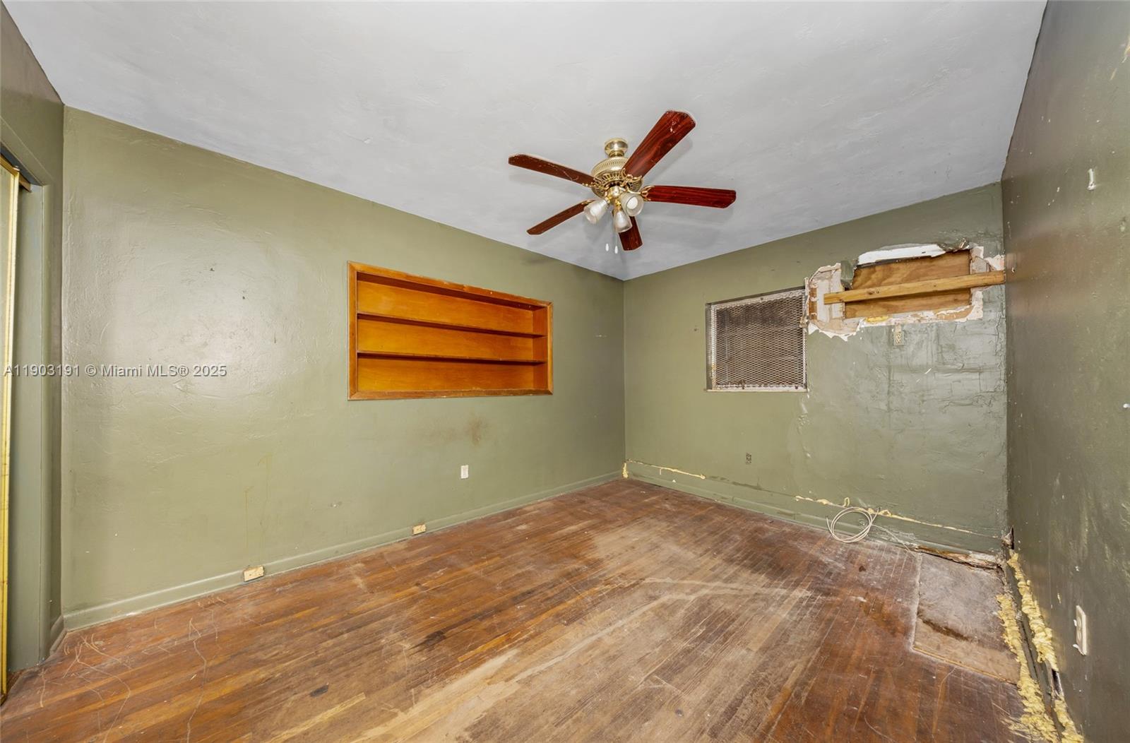 75 Northwest 83rd Street Miami, FL 33150 - Photo 25 of 47 a view of a big room with wooden floor and windows