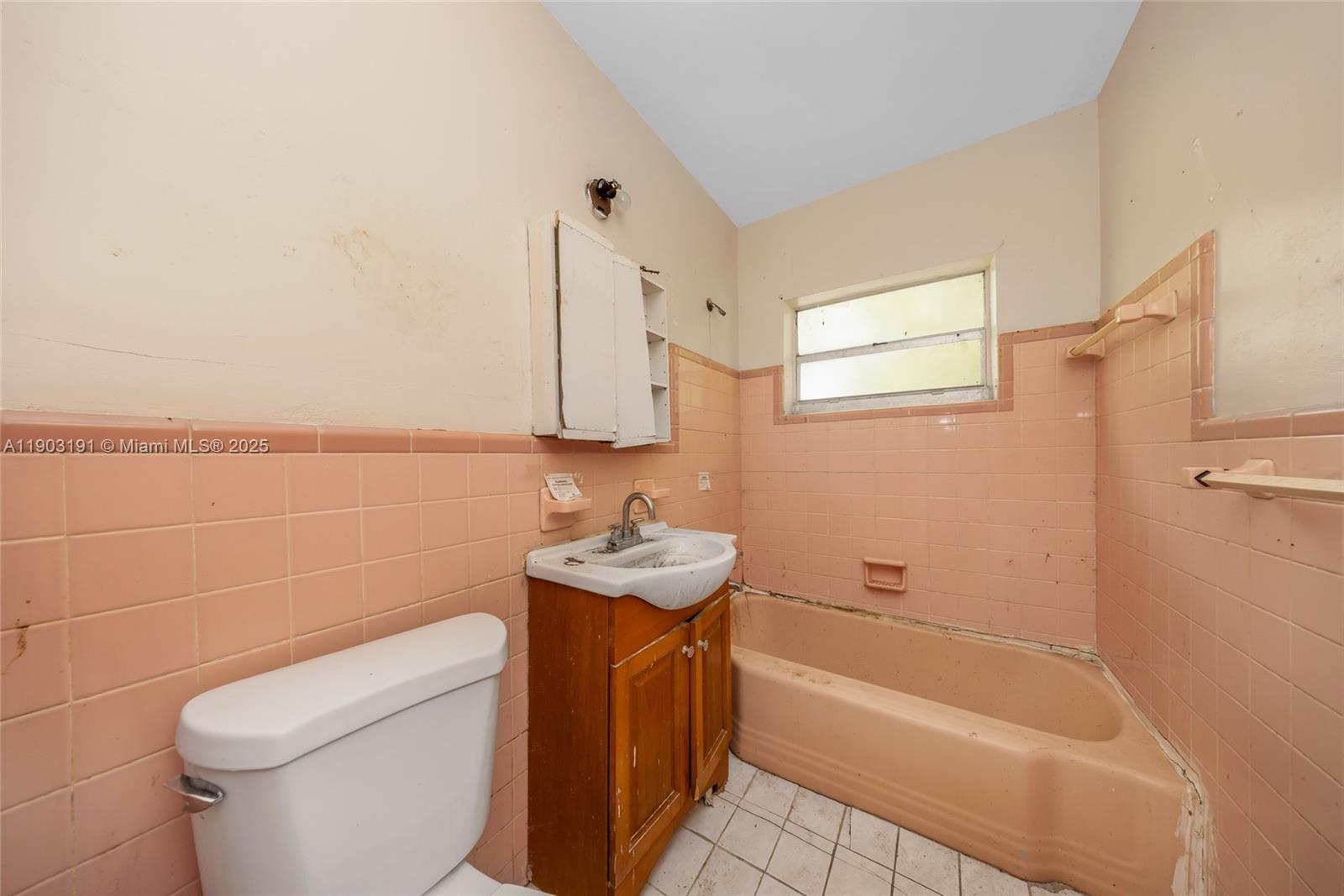 75 Northwest 83rd Street Miami, FL 33150 - Photo 26 of 47 a bathroom with a sink a toilet and bathtub