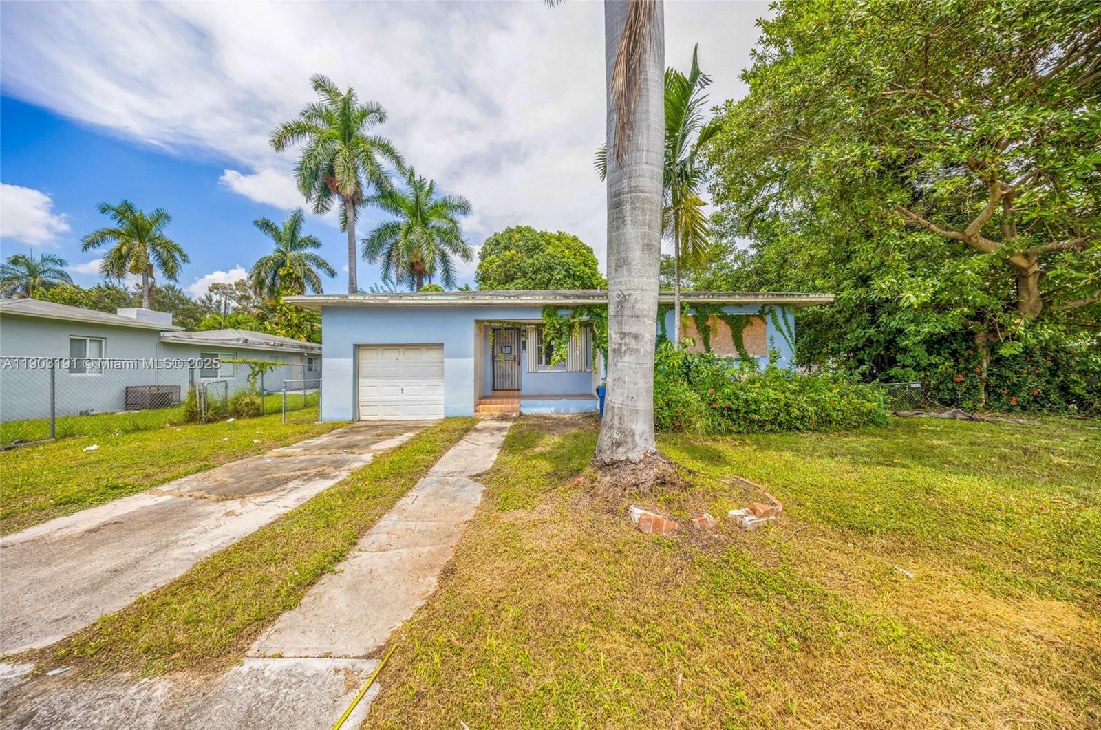 75 Northwest 83rd Street Miami, FL 33150 - Photo 30 of 47 a view of house with outdoor space and garden