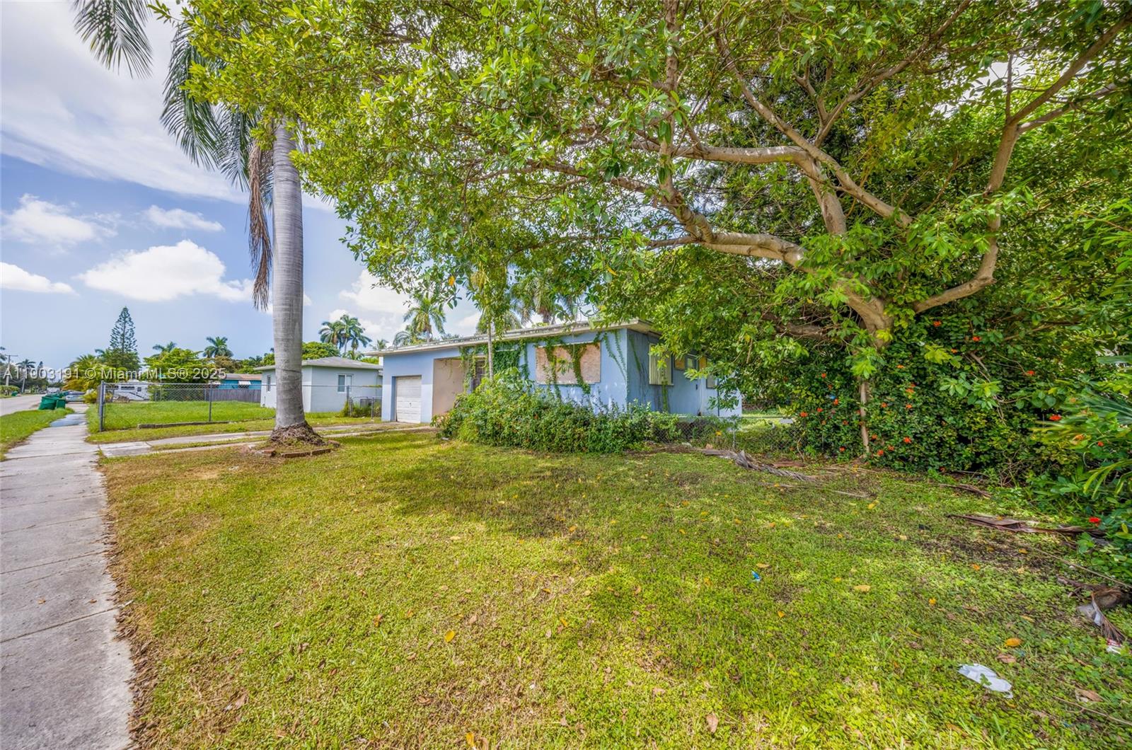 75 Northwest 83rd Street Miami, FL 33150 - Photo 31 of 47 a view of a house with pool and trees