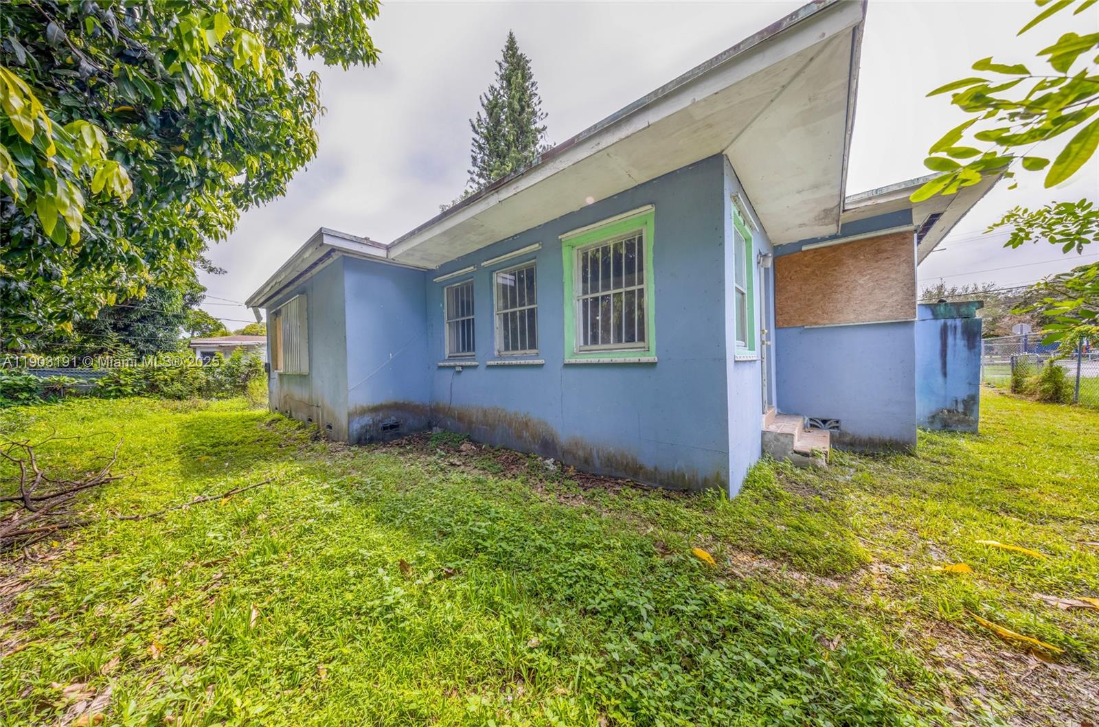 75 Northwest 83rd Street Miami, FL 33150 - Photo 32 of 47 a view of front of house with a yard