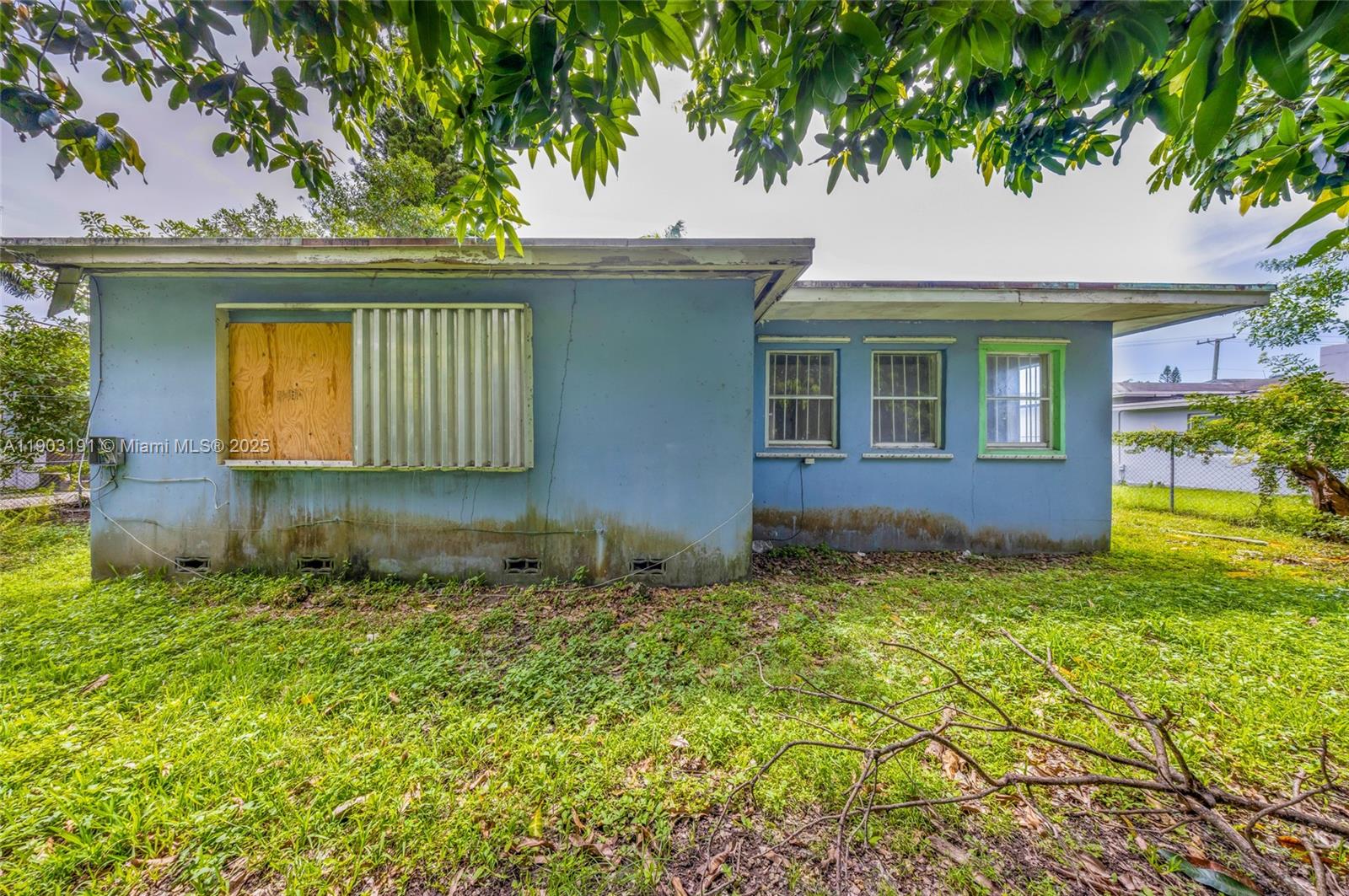 75 Northwest 83rd Street Miami, FL 33150 - Photo 33 of 47 a front view of a house with garden