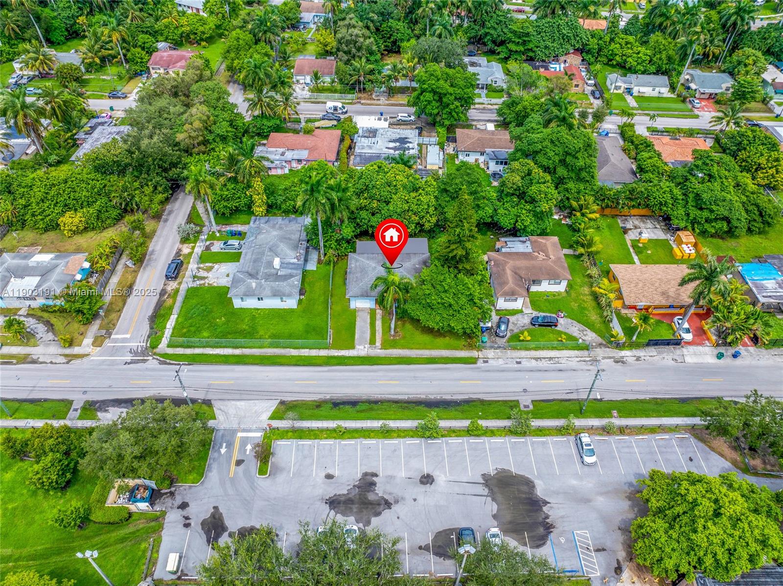 75 Northwest 83rd Street Miami, FL 33150 - Photo 36 of 47 an aerial view of a tennis ground with large trees