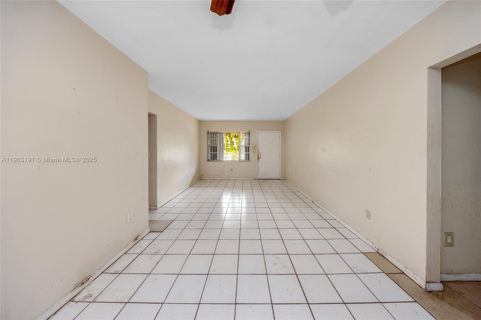 75 Northwest 83rd Street Miami, FL 33150 - Photo 4 of 47 a view of an empty room and window