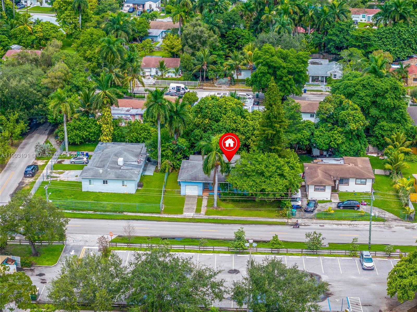 75 Northwest 83rd Street Miami, FL 33150 - Photo 46 of 47 a sign that is sitting in front of a house
