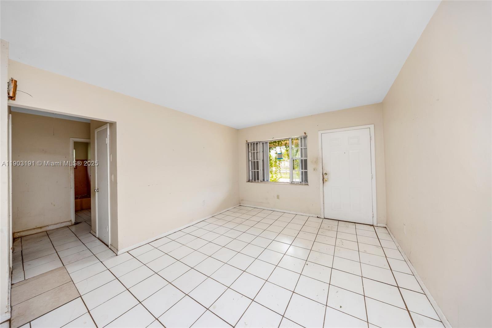 75 Northwest 83rd Street Miami, FL 33150 - Photo 5 of 47 a view of an empty room and window