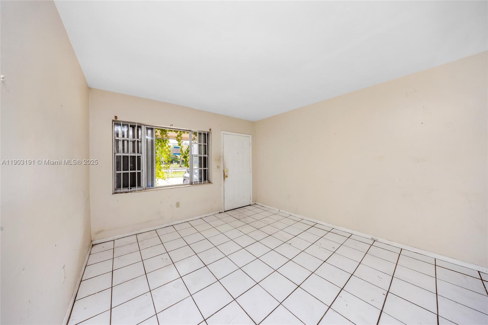 75 Northwest 83rd Street Miami, FL 33150 - Photo 6 of 47 a view of an empty room and window