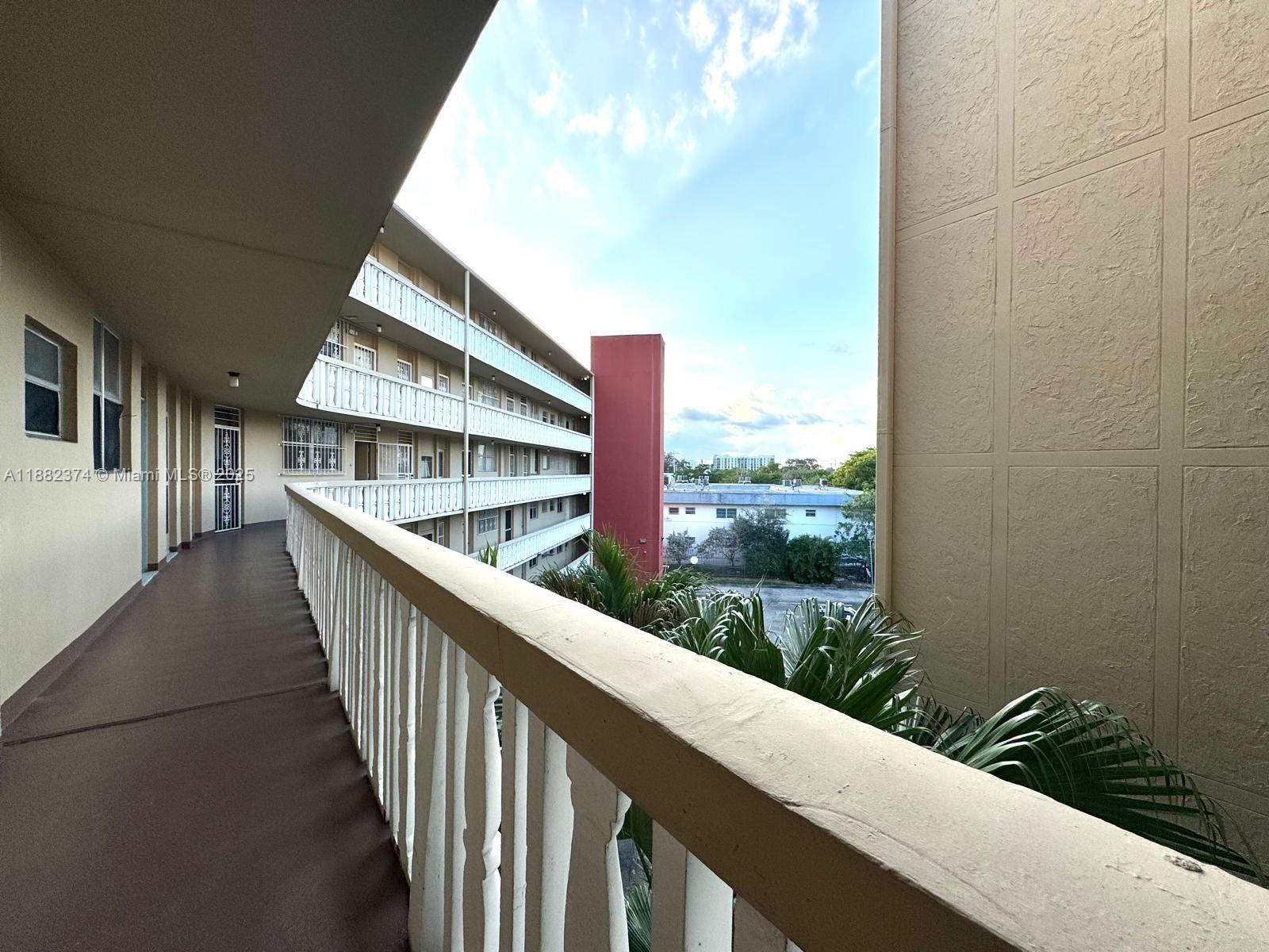 1475 Northeast 125th Terrace, Unit 404B North Miami, FL 33161 - Photo 19 of 22 a view of balcony with furniture