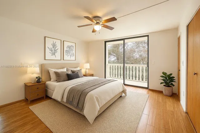 a spacious bedroom with a bed and a large window