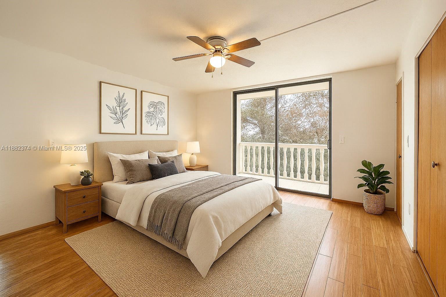 1475 Northeast 125th Terrace, Unit 404B North Miami, FL 33161 - Photo 2 of 22 a spacious bedroom with a bed and a large window