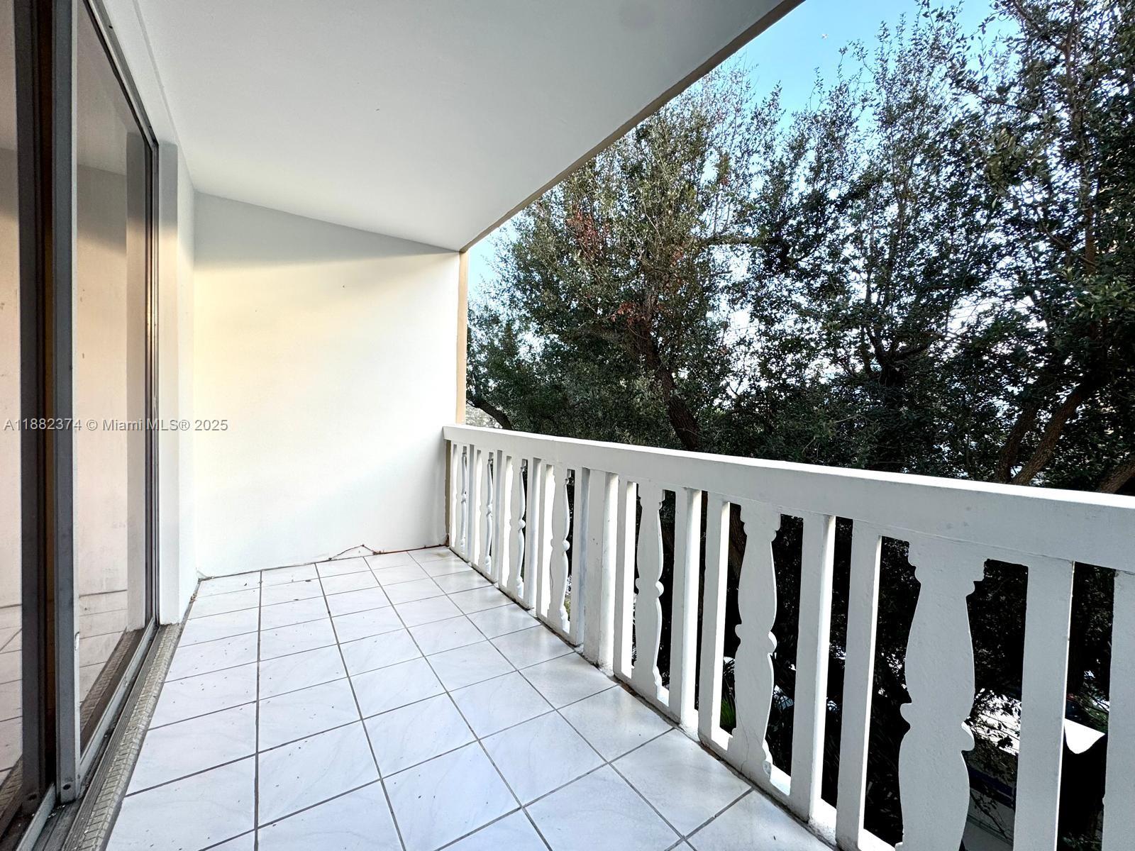 1475 Northeast 125th Terrace, Unit 404B North Miami, FL 33161 - Photo 3 of 22 a view of a balcony