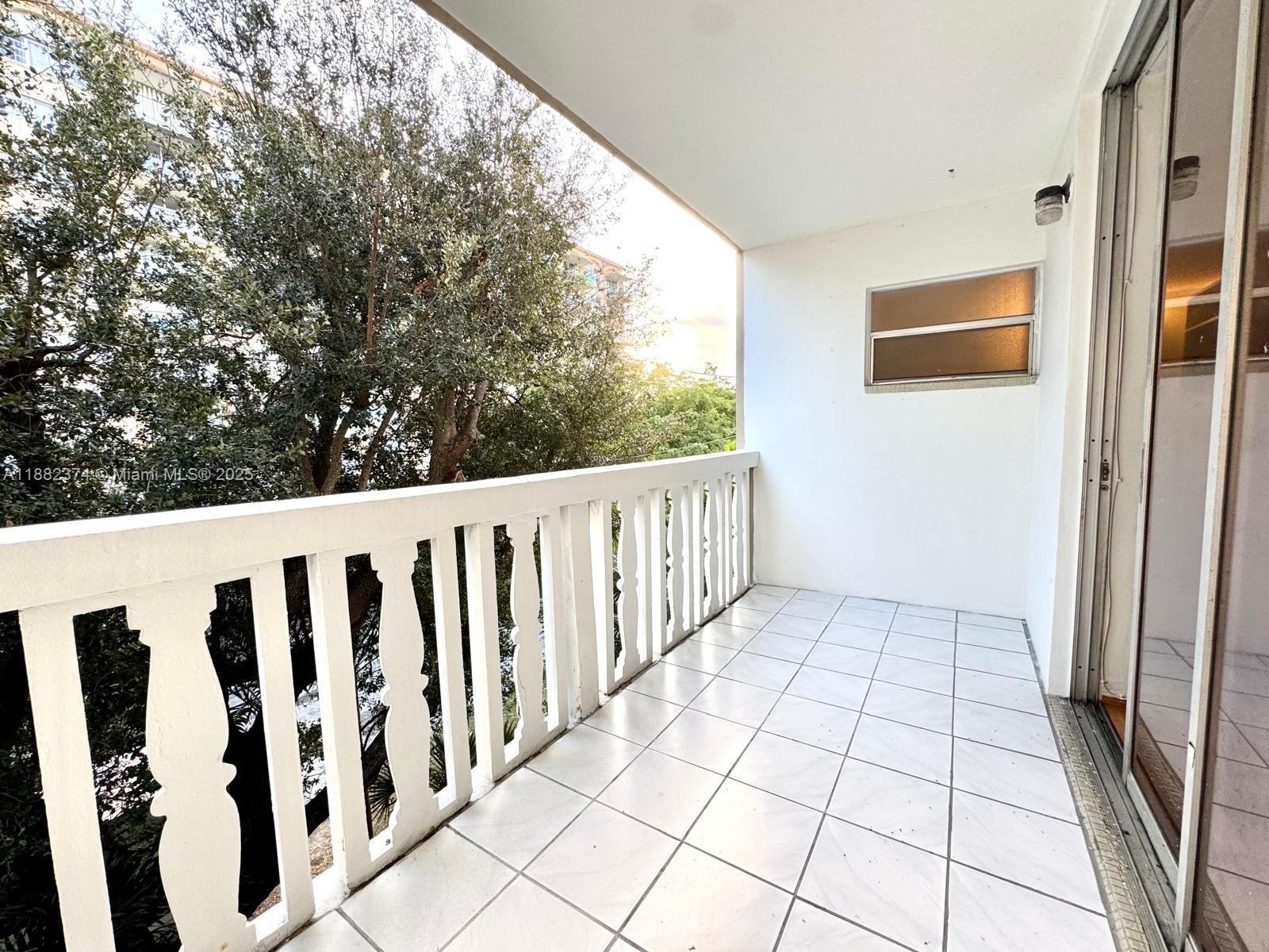 1475 Northeast 125th Terrace, Unit 404B North Miami, FL 33161 - Photo 4 of 22 a view of a balcony