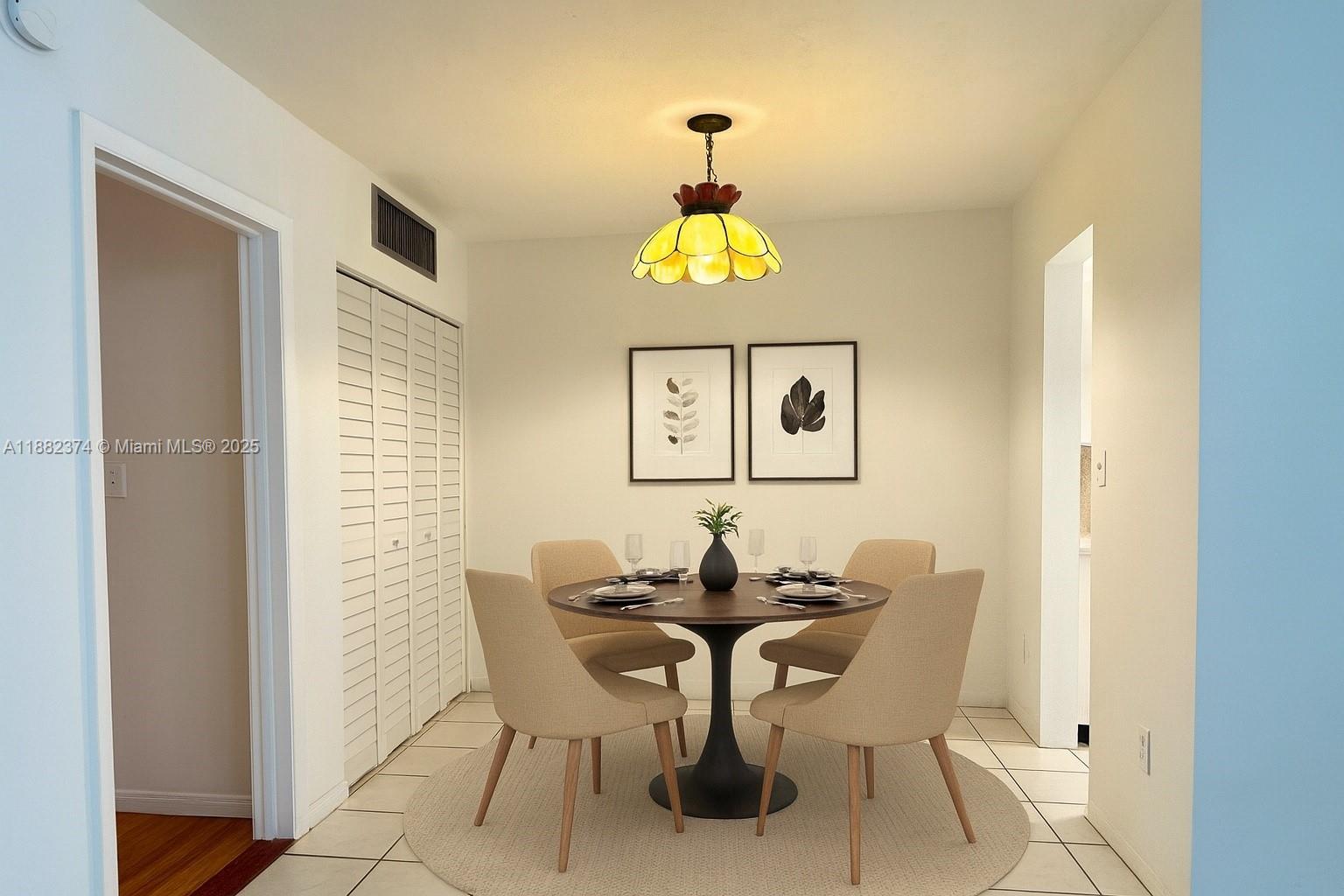 1475 Northeast 125th Terrace, Unit 404B North Miami, FL 33161 - Photo 9 of 22 a dining room with furniture and window