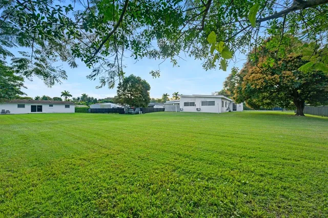 a view of a trees in front of a house
