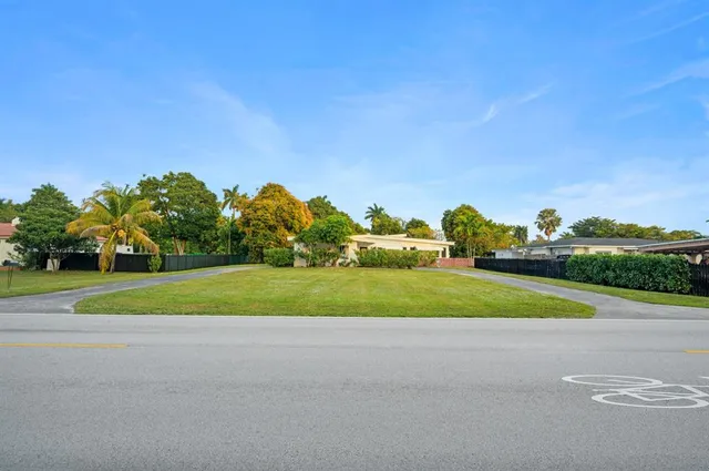 a view of a golf course with a road