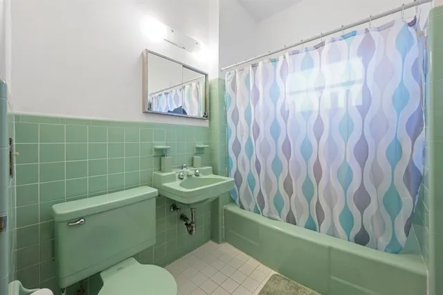 a bathroom with a toilet and a sink