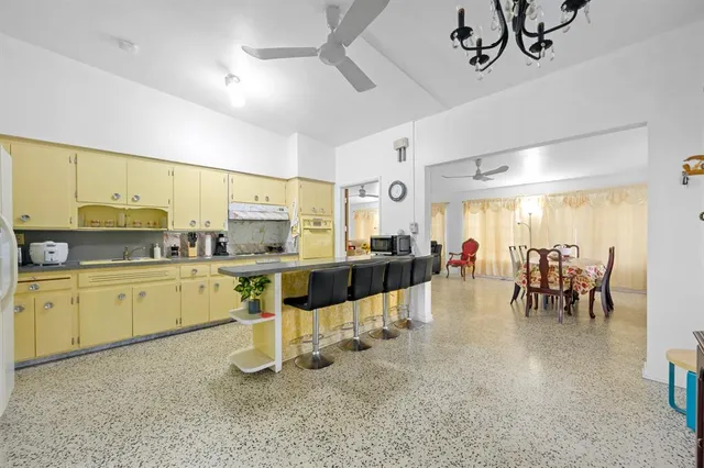 a kitchen with counter top space cabinets and appliances