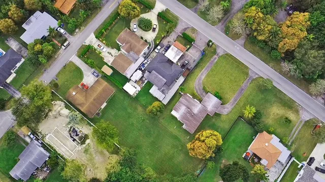 an aerial view of a house with a garden