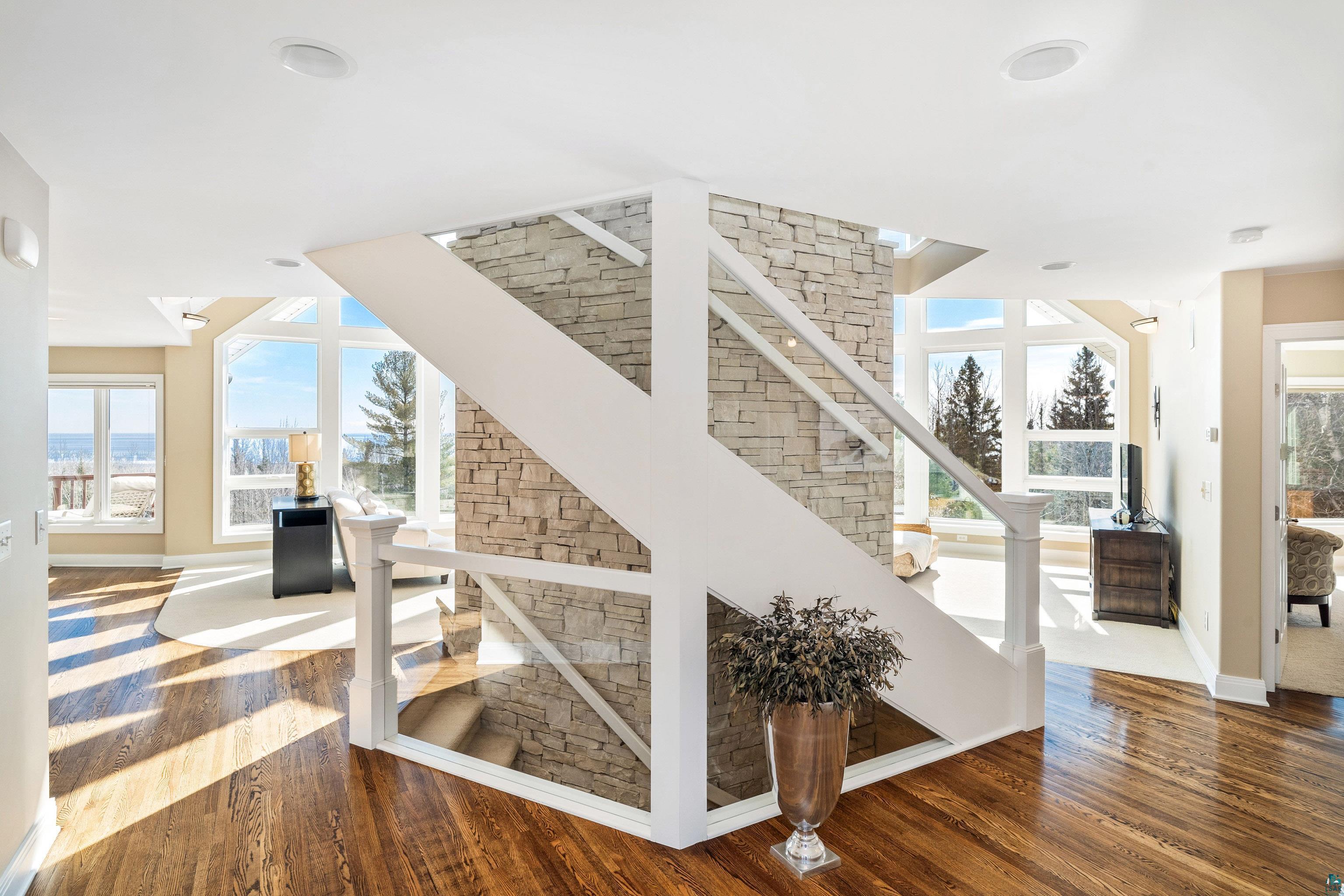 5290 Lakewood Road Duluth, MN 55804 - Photo 6 of 50 Massive floor-to-ceiling fireplace is the centerpiece for the home.