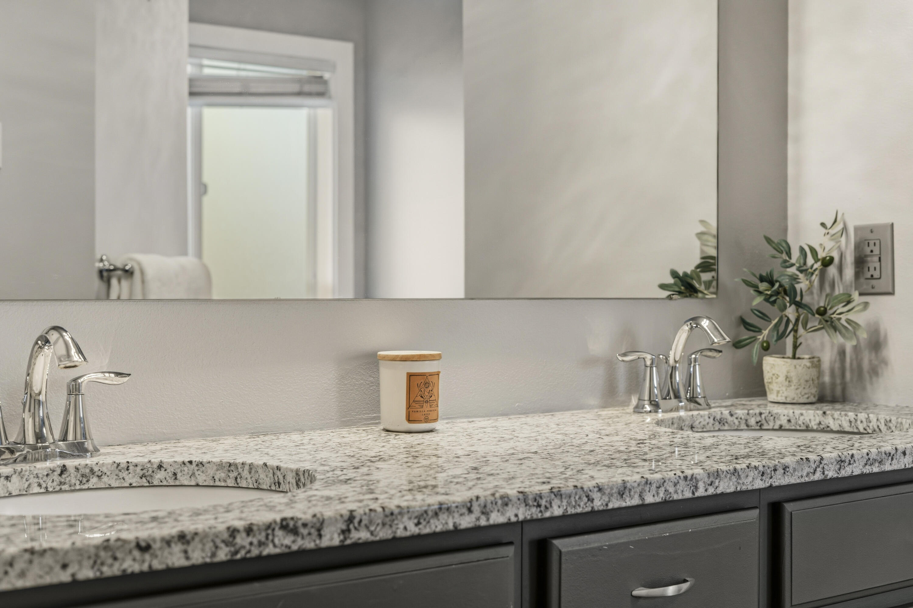 16050 Dick Road La Pine, OR 97739 - Photo 26 of 59 a bathroom with a granite countertop sink and a white cabinets