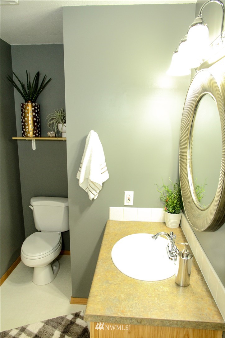 17511 26th Drive Southeast Bothell, WA 98012 - Photo 14 of 23 a bathroom with a toilet and a mirror