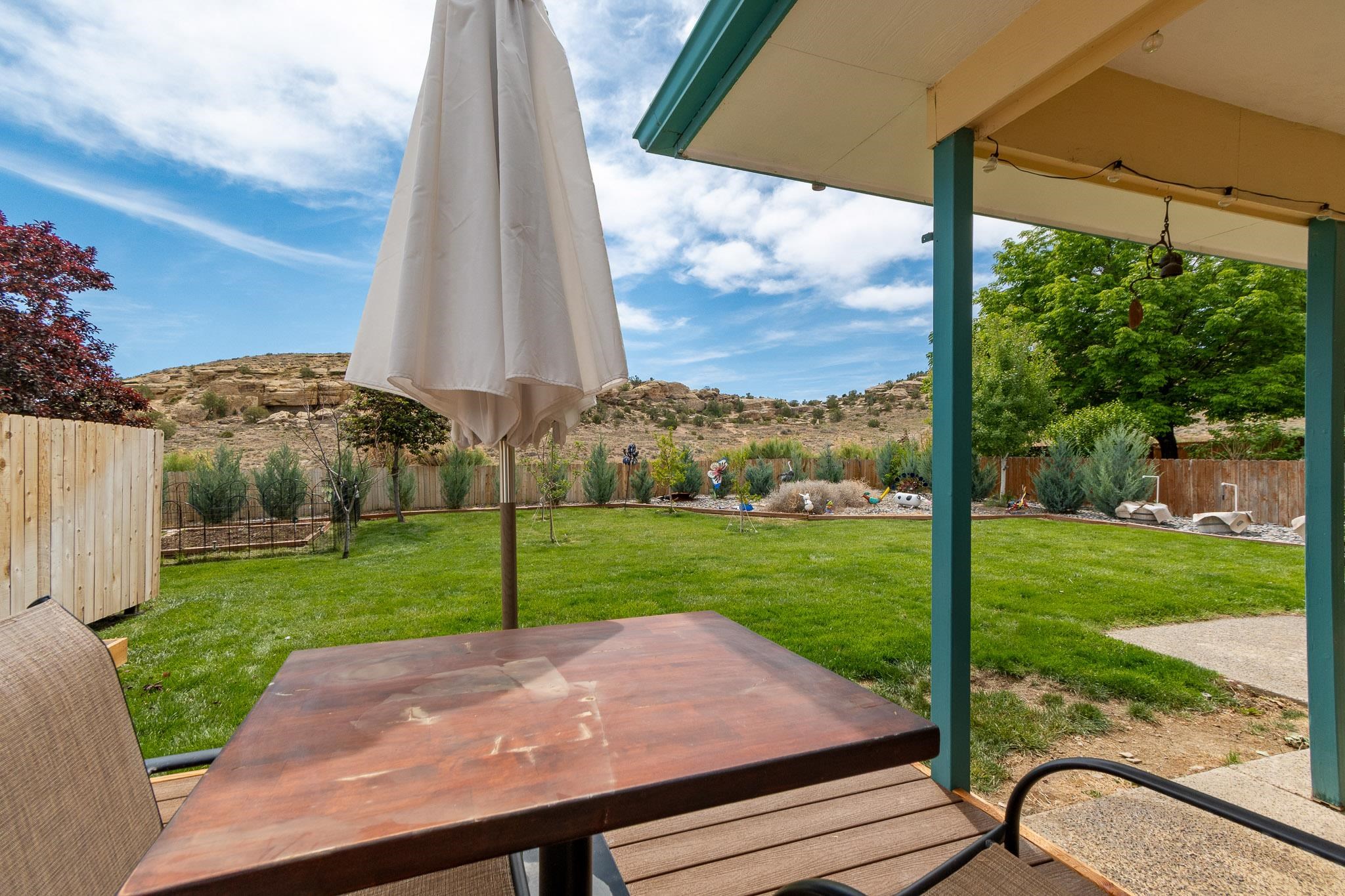 398 Butte Court Grand Junction, CO 81507 - Photo 26 of 33 a view of a yard with a table and chairs