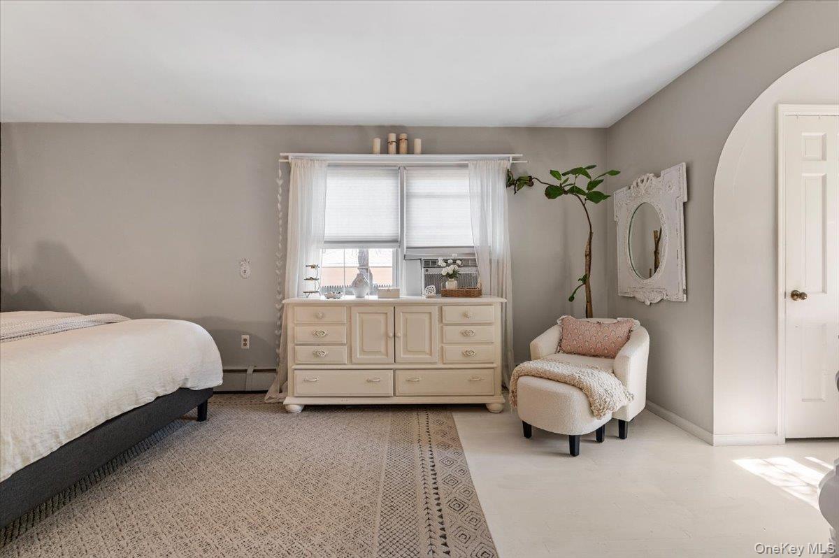 10 Rancher Place Huntington, NY 11743 - Photo 21 of 44 Spacious room featuring neutral painted walls and a light-toned area rug over a lighter floor