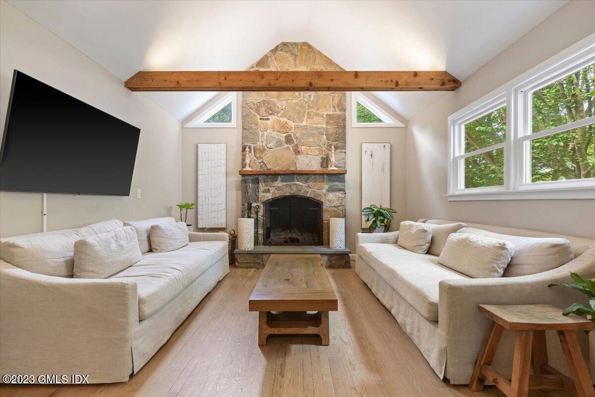 5 Sunshine Avenue Riverside, CT 06878 - Photo 17 of 35 a living room with furniture and a fireplace