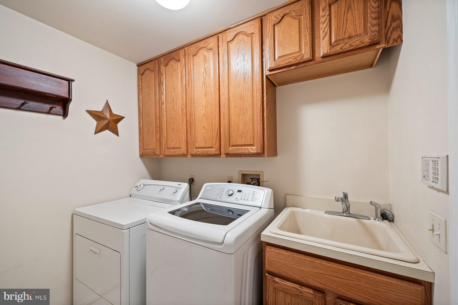 8037 Crest Road Laurel, MD 20723 - Photo 18 of 60 a utility room with dryer and washer